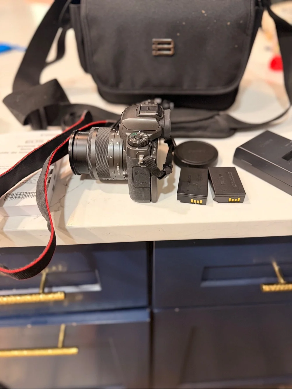 Canon Black Mirrorless Camera with Black Lens and Accessories